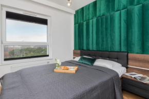 9th Floor Green and Grey Apartment in Gdańsk Brzeźno with Two Bedrooms and Parking by Noclegi Renters